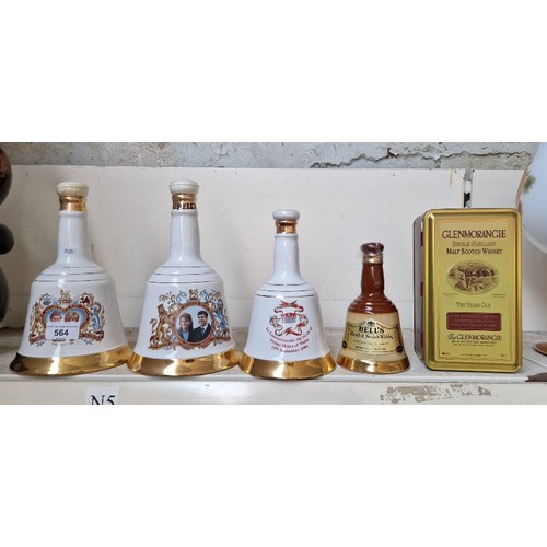 564 - Three royal commemorative Bells scotch whisky decanters (full) another Bells decanter (opened) and a... 