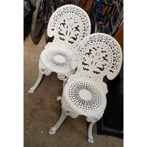18 - A pair of metal matching garden chairs
