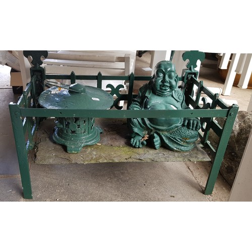 4 - A cast iron fire grate with seated Buddha and metal incense burner