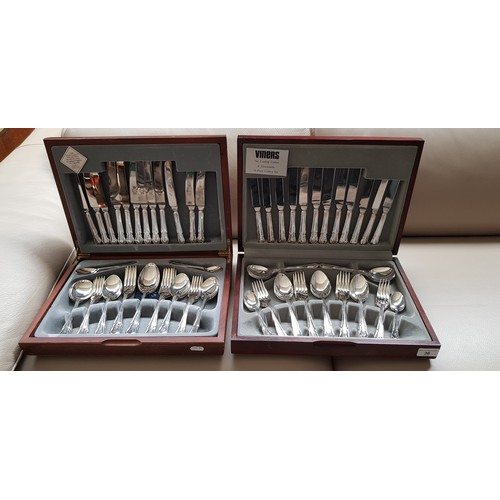 36 - Two canteens of silver plated cutlery.
