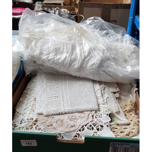 143 - A box of vintage linen & 2 christening gowns.