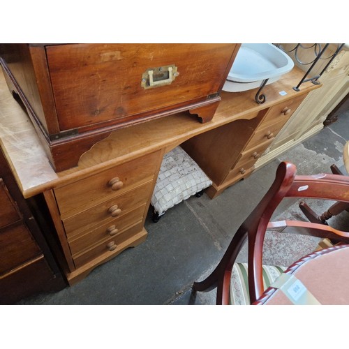 904 - A pine pedestal dressing table and a non matching stool.