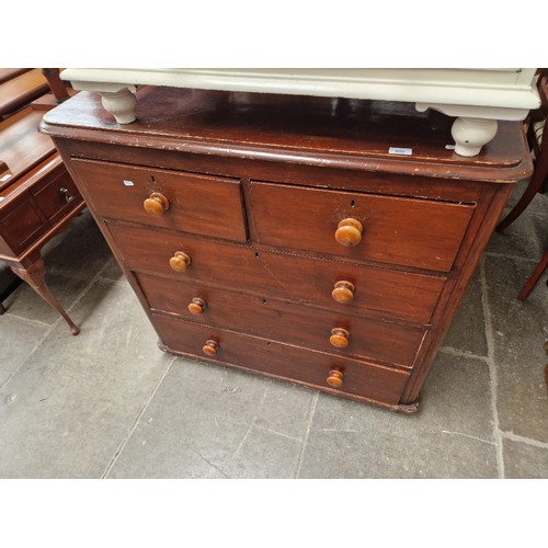 900 - A Victorian stained pine chest of drawers.