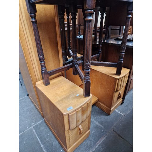 909 - An Art Deco light oak dressing table and matching wardrobe.