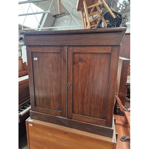 922 - A 19th century cabinet with fitted drawers.