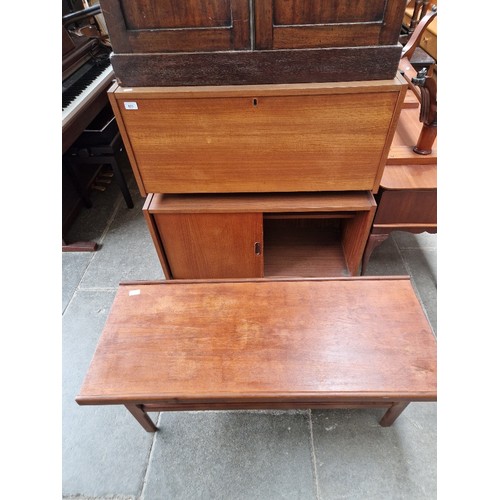 923 - A mid 20th century two part teak unit & a teak coffee table.