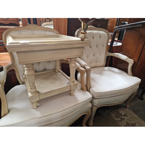 930 - A pair of French style cream armchairs and similar table.