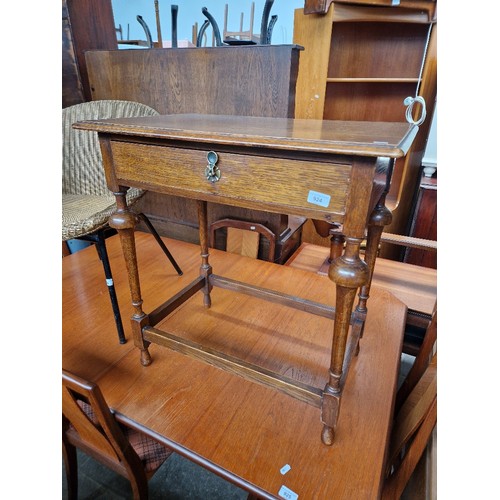 924 - An oak single drawer side table.