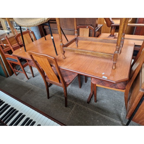 925 - A G-Plan teak table and chairs together with a Dynatron cabinet and a coffee table. Buyer must remov... 