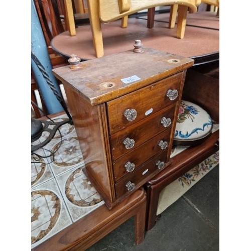 935 - A mixed lot comprising an apprentice chest of drawers, two needlework stools and a wall cabinet with... 