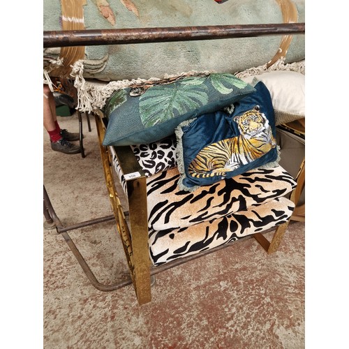 956 - A gold tone rectangular section framed arm chair with tiger print upholstery, together with various ... 