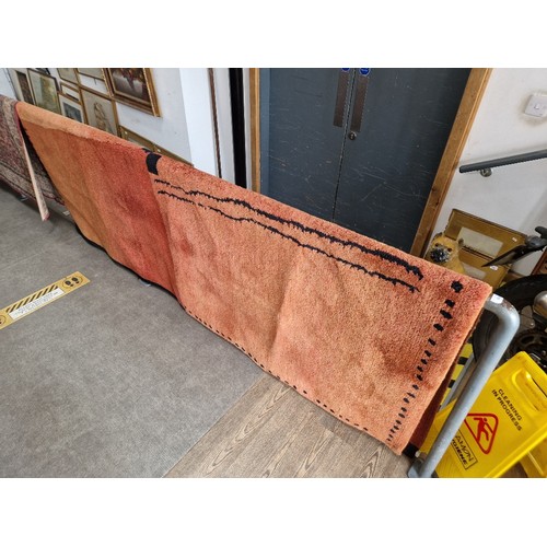 964 - A large red ground carpet 180cm x 269cm.