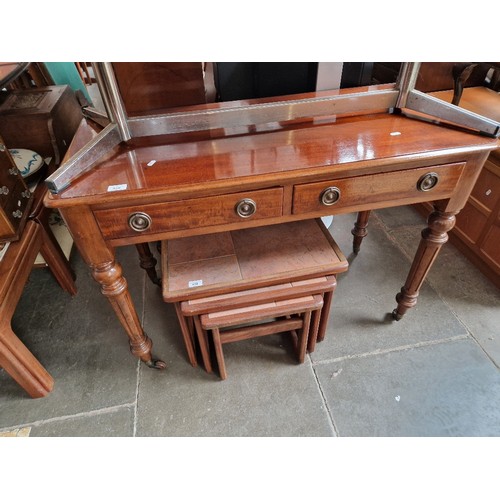 938 - A Victorian two drawer writing table.