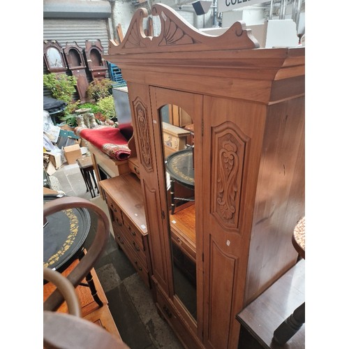 943 - An Edwardian satin wood wardrobe and dressing table.