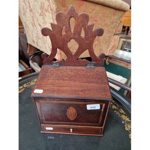 945 - A George III inlaid mahogany salt box.