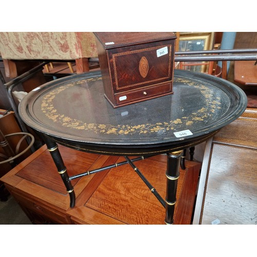 946 - A reproduction papier mache tray table.