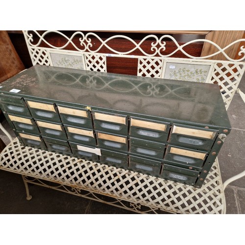 950 - Green metal file drawers.