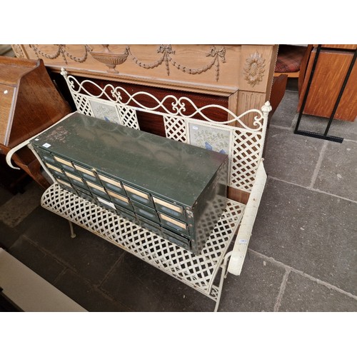 949 - A folding metal garden seat.