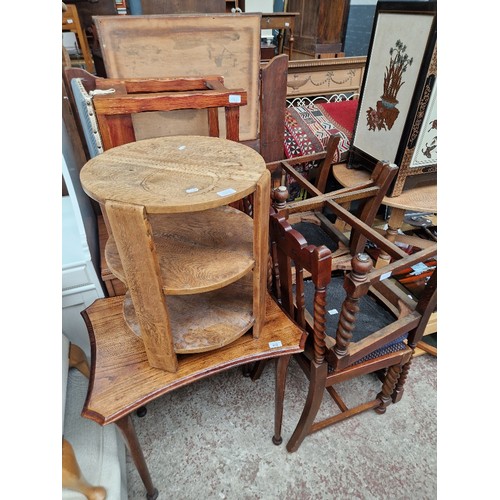 952 - A mixed lot of furniture comprising a set of four chairs, a sewing machine, an occasional table and ... 