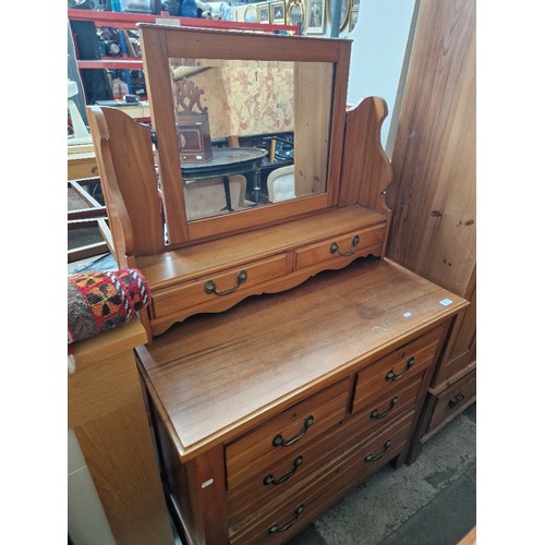 943 - An Edwardian satin wood wardrobe and dressing table.