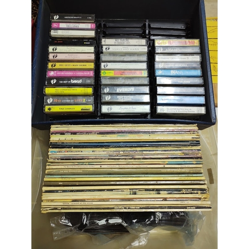 125 - A box of vinyl LP records, cassettes and 45s including Bob Dylan, Kate Bush, The Who, The Rolling St... 