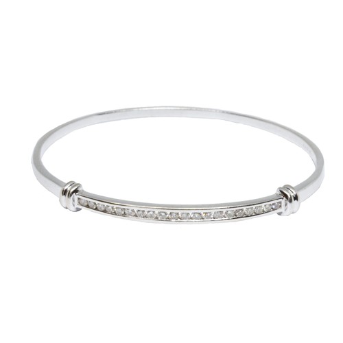 6 - A diamond bangle, twenty round brilliant cut stones weighing approximately 1ct in total, white metal... 