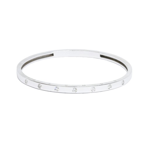 5 - A diamond bangle, square section set with nineteen round brilliant cut stones weighing approximately... 