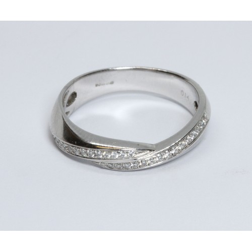 12 - An 18ct white gold diamond ring, pave set round brilliant cut diamonds in cross over setting weighin... 