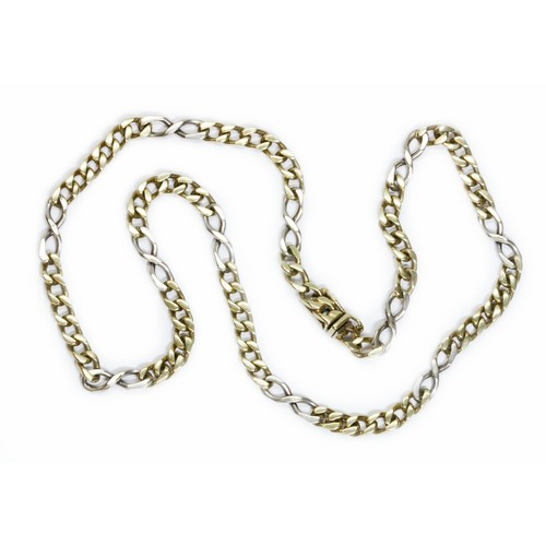 20 - A two colour figaro chain, marked '9K', length 41cm, weight 18.6g.