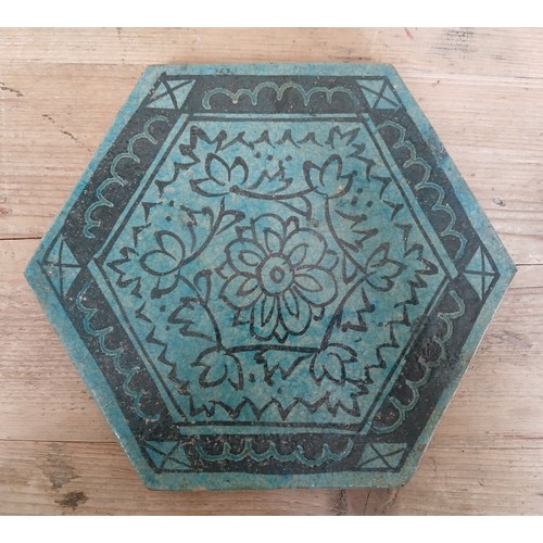 432 - A Persian tile of hexagonal form, length 23.5cm, together with a modern Chinese dish.