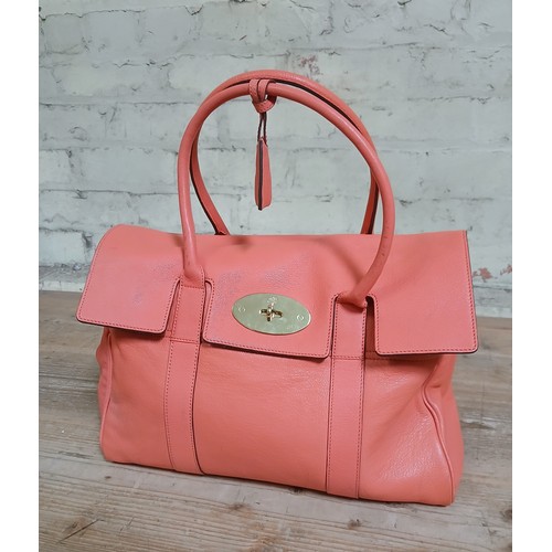 451 - A Mulberry Bayswater Bright Coral leather bag with gold tone fittings.