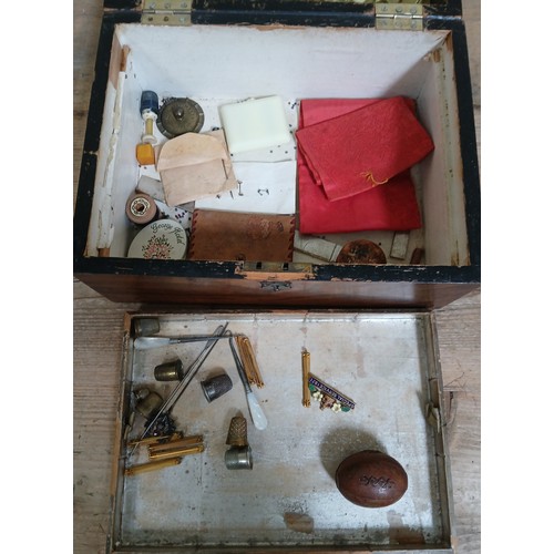 439 - A walnut sewing box containing various collectables, thimbles, Special Service badges, sewing tools,... 