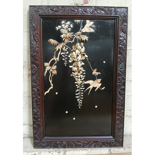 437 - A Japanese carved bone and black lacquer panel, carved wood frame 47cm x 72cm.