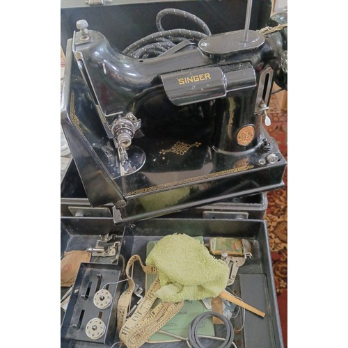 485 - A Singer Featherweight sewing machine with case and accessories.