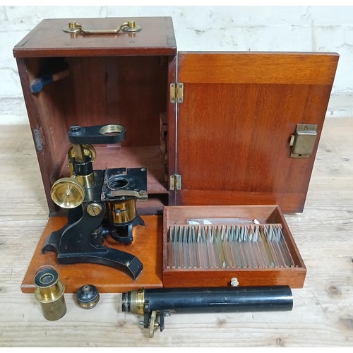 467 - A 19th century brass microscope, with mahogany case and accessories.