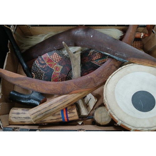 476 - A box of assorted Australian aboriginal and other ethnic items including boomerangs, shield, rain st... 