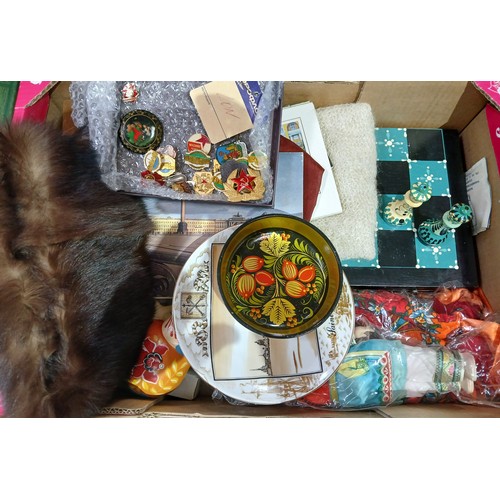 462 - A box of mainly Russian collectables including badges, a chess set, papier mache etc.