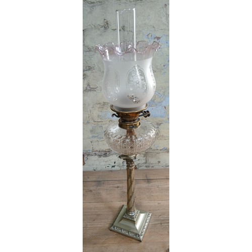 495 - A silver plated and cut glass oil lamp on column base, Hawksworth Eyre & Co, length 75cm.