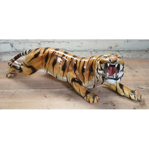 491 - A large Italian pottery tiger, length 82cm.