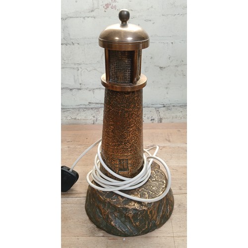 494 - A cast brass light house table lamp, height 36cm.