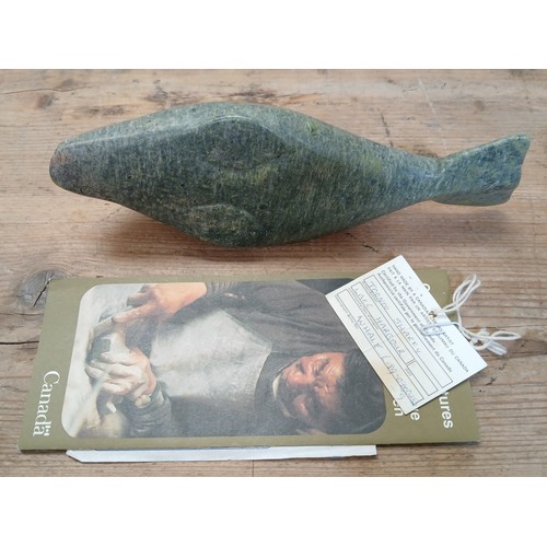 489 - Toonoo Sharky, Lake Harbour, Canadian Eskimo, a carved steatite sculpture modelled as a whale, lengt... 