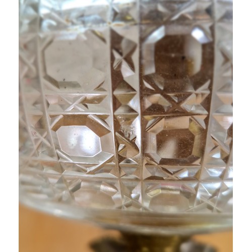 495 - A silver plated and cut glass oil lamp on column base, Hawksworth Eyre & Co, length 75cm.