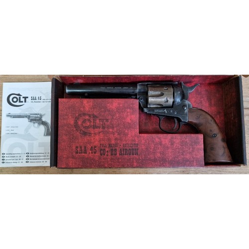 16 - A Colt SAA .45 4.5mm calibre Co2 BB air gun, 27cm long, in original box with manual. (BUYER MUST BE ... 