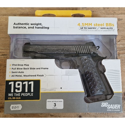 3 - A Sig Sauer 1911 4.5mm calibre Co2 air BB gun, '1776, we the people', serial no.18306622, 20cm long,... 