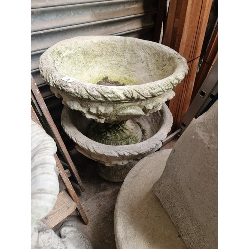 16 - A pair of concrete pedestal planters