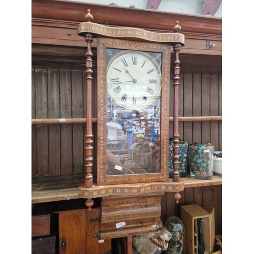 55 - An American Ansonia wall clock.