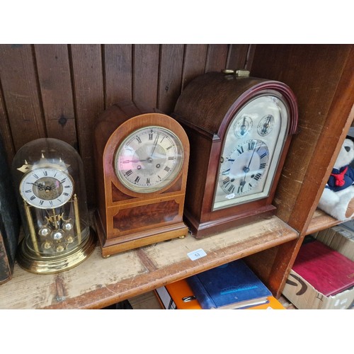 53 - A bracket clock, a mantle clock, keys and pendulums present and a quartz clock.