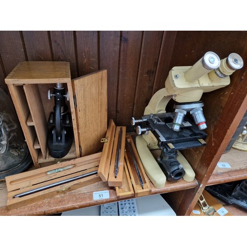 51 - A boxed microscope together with another microscope and three boxed surgical knives