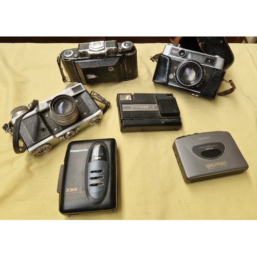 64 - A small box of assorted vintage cameras & 2 personnel cassette players.