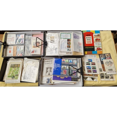 68 - Three box files containing stamps, first day covers, a stamp album and a box of PHQ cards